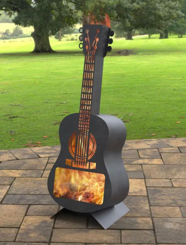 Fire pit designed as a guitar, suitable for outdoor gatherings and entertainment.